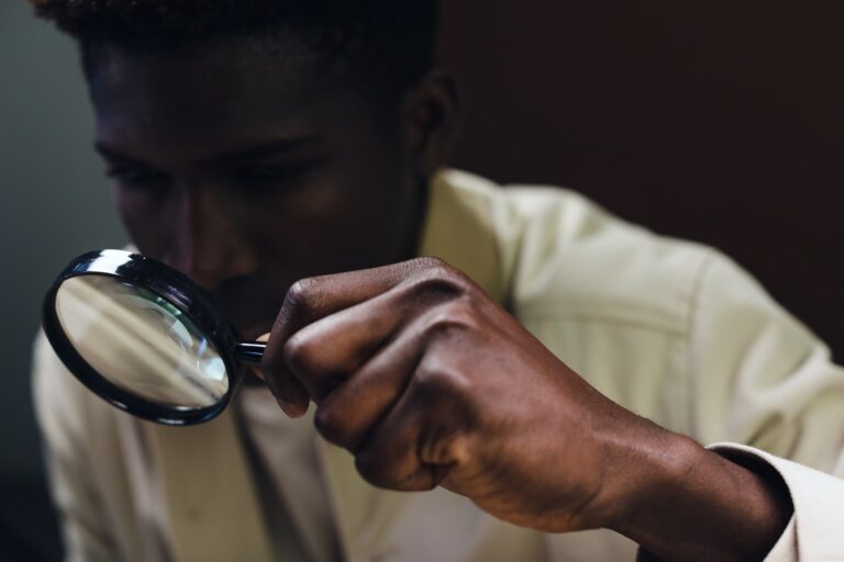 A Man Holding a Magnifying Glass